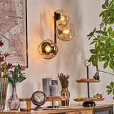 Moderne unregelmäßige Glas-Globe-Wandleuchten mit schwarzem Metallrahmen für Wohnzimmer und Schlafzimmer 