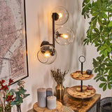 Moderne Glas-Kugel-Wandleuchten mit schwarzem Metallrahmen für Wohnzimmer und Schlafzimmer 