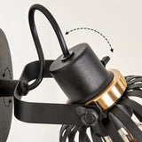 Industrielle Wandleuchte mit schwarzem Käfigschirm und goldenen Akzenten für Wohnzimmer und Schlafzimmer 