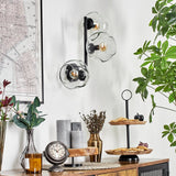 Moderne unregelmäßige Glas-Globe-Wandleuchten mit schwarzem Metallrahmen für Wohnzimmer und Schlafzimmer 