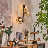 Moderne unregelmäßige Glas-Globe-Wandleuchten mit schwarzem Metallrahmen für Wohnzimmer und Schlafzimmer 