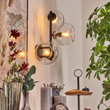 Moderne Glas-Kugel-Wandleuchten mit schwarzem Metallrahmen für Wohnzimmer und Schlafzimmer 