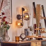 Moderne mehrflammige Glas-Wandleuchte mit schwarzem Metallrahmen für Wohnzimmer und Schlafzimmer 