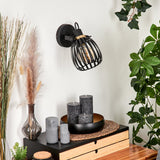Industrielle Wandleuchte mit schwarzem Käfigschirm und goldenen Akzenten für Wohnzimmer und Schlafzimmer 