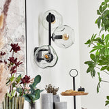 Moderne unregelmäßige Glas-Globe-Wandleuchten mit schwarzem Metallrahmen für Wohnzimmer und Schlafzimmer 