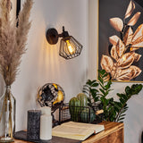Industrielle schwarze Wandleuchte mit Metallkäfig und verstellbarem Arm für Wohnzimmer und Schlafzimmer 