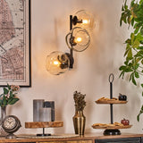 Moderne unregelmäßige Glas-Globe-Wandleuchten mit schwarzem Metallrahmen für Wohnzimmer und Schlafzimmer 