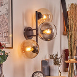 Moderne mehrflammige Glas-Wandleuchte mit schwarzem Metallrahmen für Wohnzimmer und Schlafzimmer 